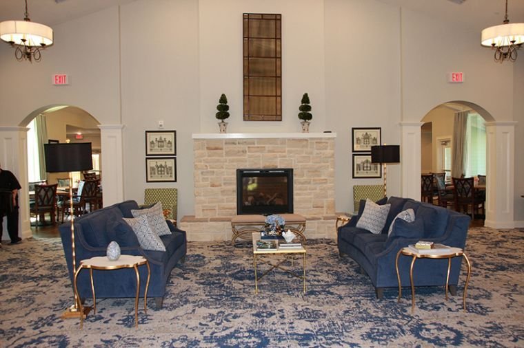 common living area with chairs and fireplace